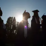 Graduation for Rainer Beach Silhouette of graduates.